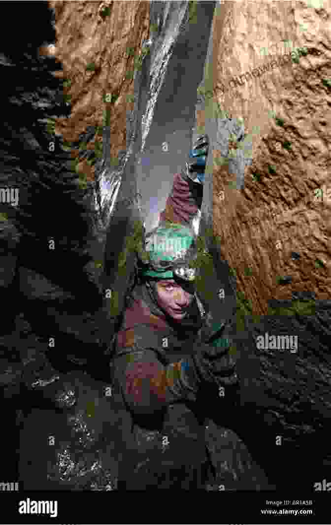 A Group Of Explorers Traversing A Narrow Underground Passage In A Cave Minnesota Underground: A Guide To Caves Karst Mines Tunnels